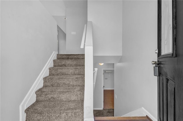 2551 Tolliver Dr, Ellenwood, GA 30294 - stairway featuring tile patterned floors and baseboards
