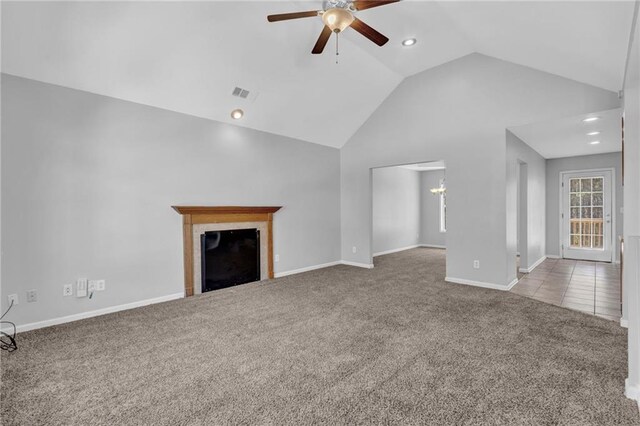 2551 Tolliver Dr, Ellenwood, GA 30294 - unfurnished living room featuring visible vents, carpet floors, lofted ceiling, a fireplace, and ceiling fan with notable chandelier