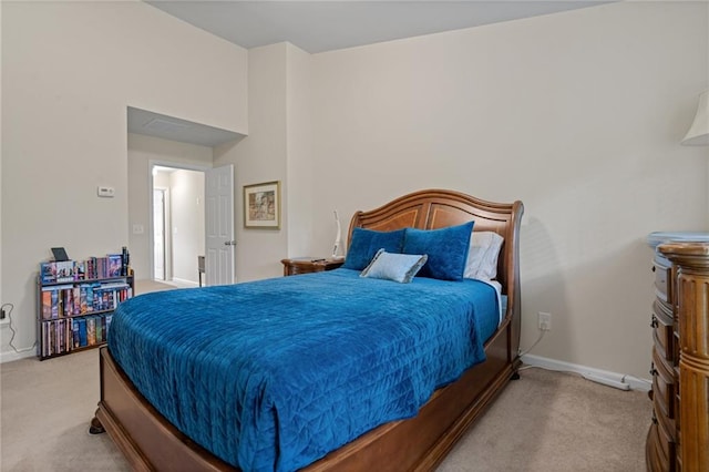 bedroom featuring light colored carpet