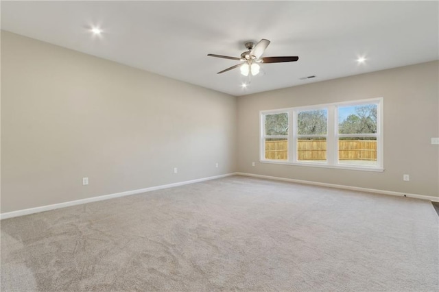 unfurnished room with visible vents, baseboards, carpet floors, recessed lighting, and a ceiling fan