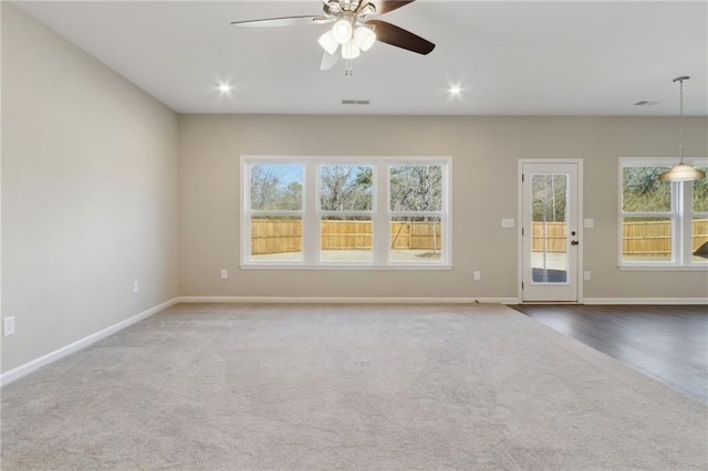 unfurnished living room featuring recessed lighting, visible vents, ceiling fan, and baseboards