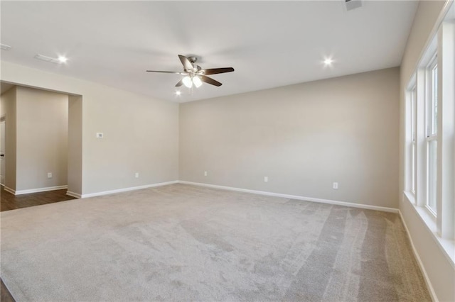 empty room with carpet flooring, recessed lighting, baseboards, and ceiling fan