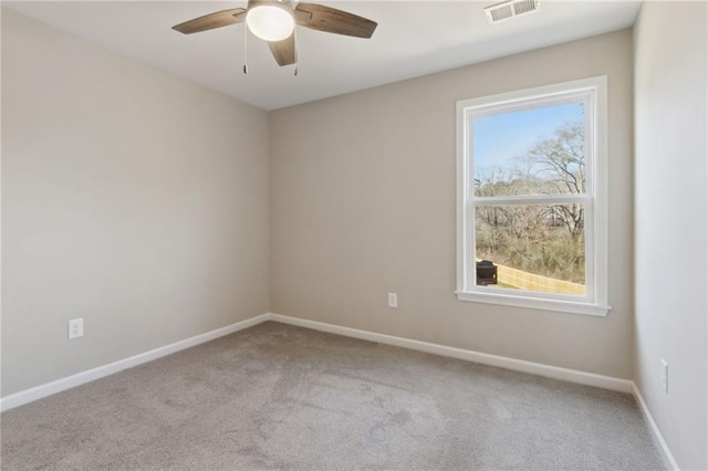 unfurnished room featuring visible vents, ceiling fan, baseboards, and carpet floors