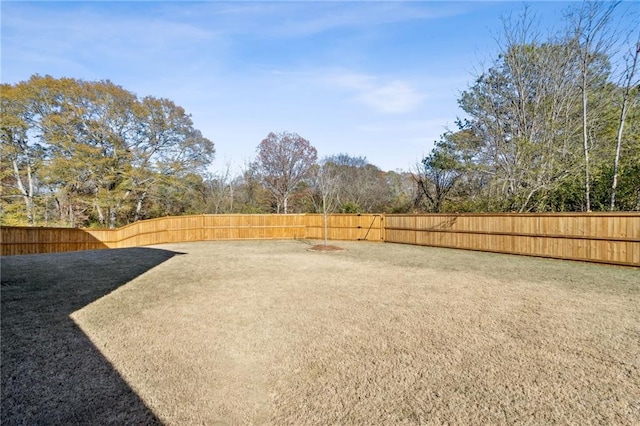 view of yard with a fenced backyard