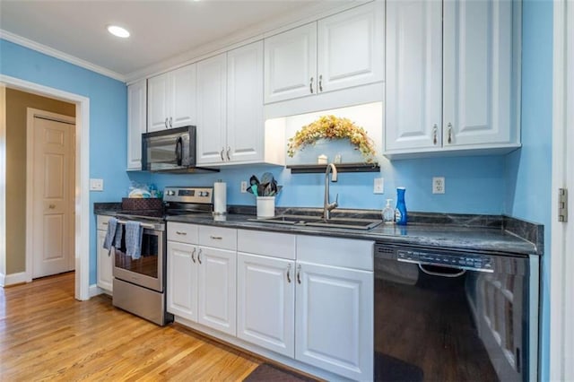 kitchen featuring black appliances, crown molding, white cabinetry, light wood-type flooring, and sink