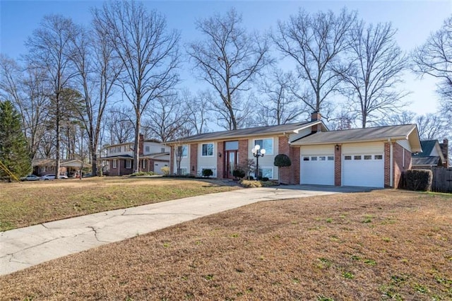 view of front of house featuring a garage and a front lawn