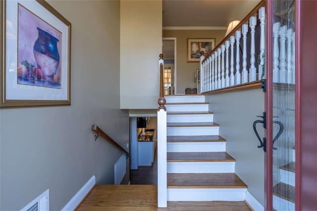 stairs with crown molding