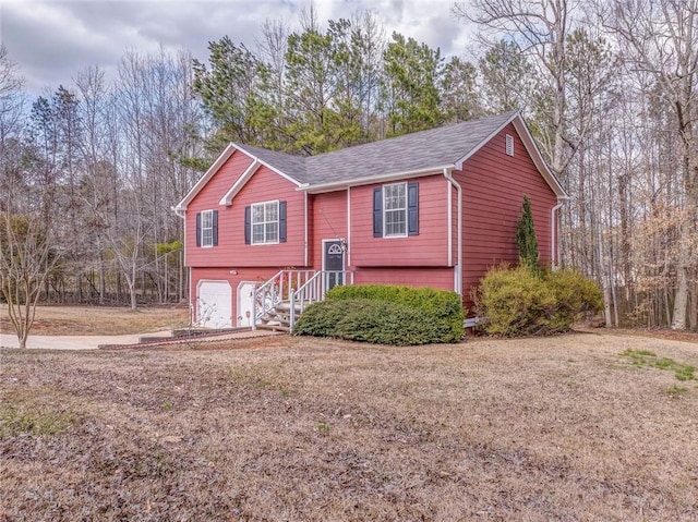 raised ranch featuring a garage