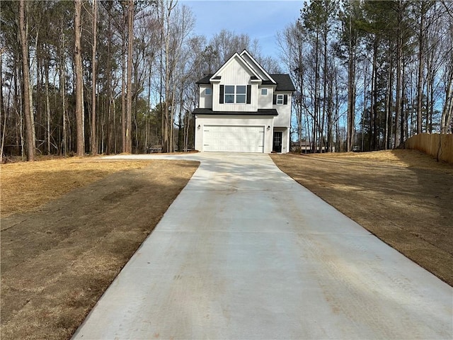 exterior space featuring board and batten siding, concrete driveway, and an attached garage