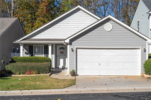 single story home featuring an attached garage and concrete driveway