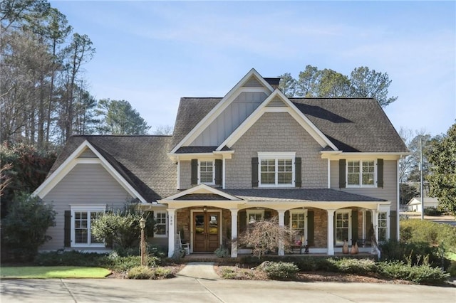 view of front facade featuring french doors and covered porch