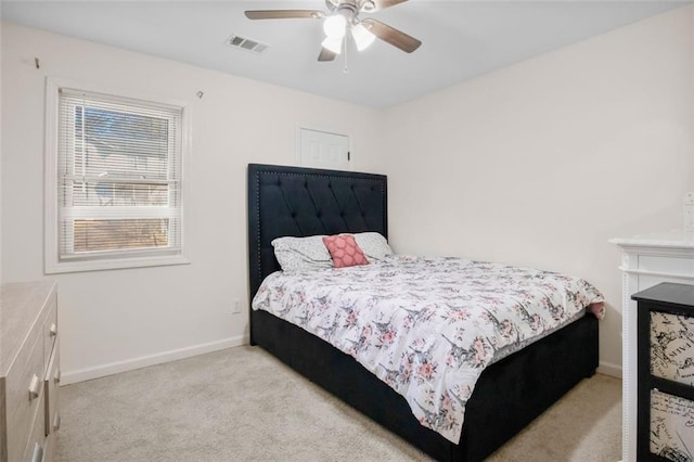 bedroom featuring ceiling fan and light colored carpet