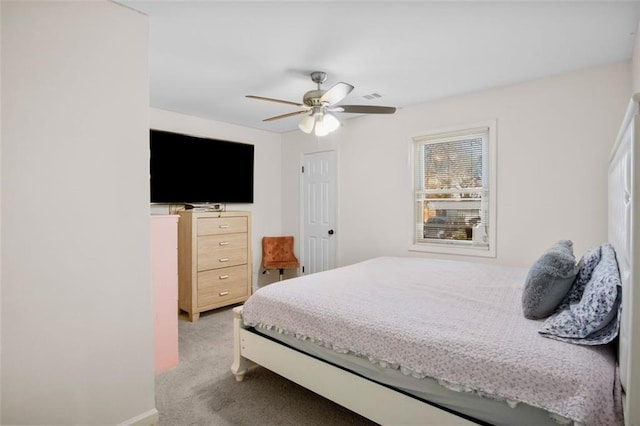 bedroom with ceiling fan and light colored carpet