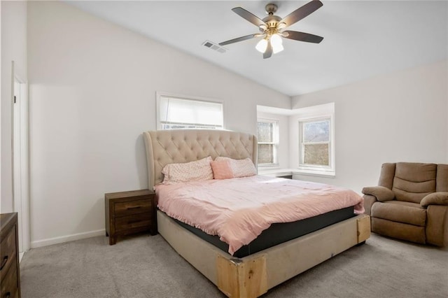 bedroom featuring ceiling fan, light colored carpet, and vaulted ceiling