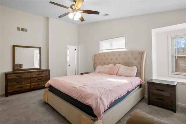 carpeted bedroom with ceiling fan and lofted ceiling