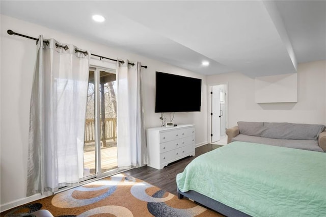 bedroom featuring dark hardwood / wood-style floors and access to outside