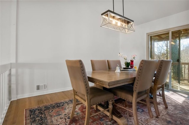 dining space featuring hardwood / wood-style flooring