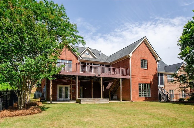 back of property featuring stairway, brick siding, a wooden deck, and french doors