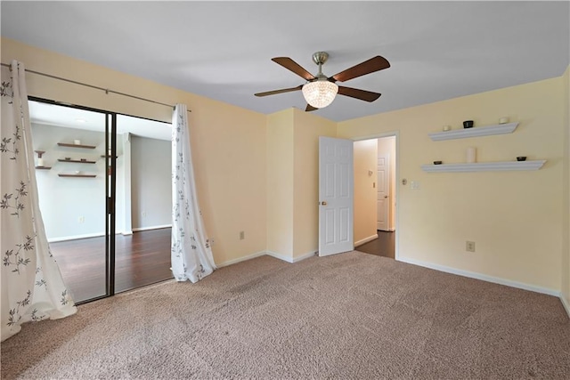 1312 Pine Heights Dr NE, Atlanta, GA 30324 - unfurnished bedroom with carpet flooring, baseboards, and a ceiling fan