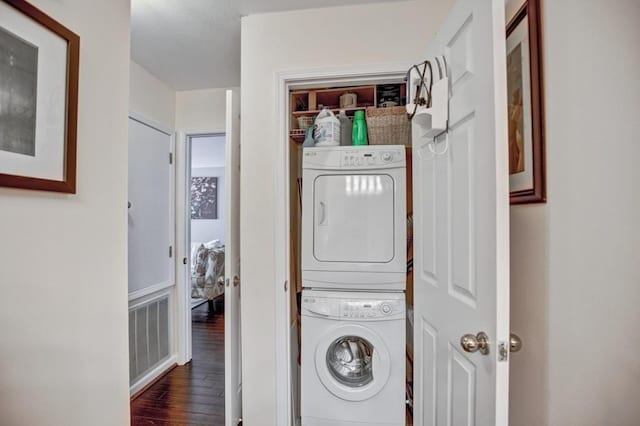 1312 Pine Heights Dr NE, Atlanta, GA 30324 - laundry room featuring stacked washer and clothes dryer and wood finished floors