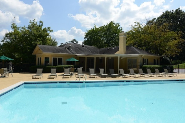 1312 Pine Heights Dr NE, Atlanta, GA 30324 - community pool with a patio and fence