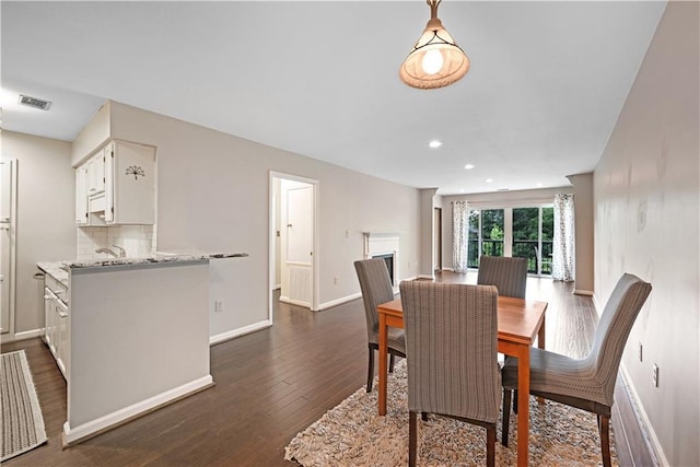 1312 Pine Heights Dr NE, Atlanta, GA 30324 - dining room with dark wood-style flooring, baseboards, and recessed lighting