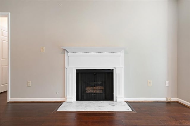 1312 Pine Heights Dr NE, Atlanta, GA 30324 - detailed view of wood finished floors, baseboards, and a fireplace with flush hearth