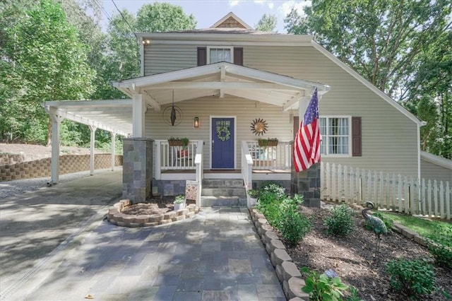 9050 Pine Tree Cir, Gainesville, GA 30506 - view of front facade with a porch, driveway, and an attached carport
