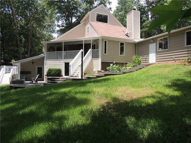 9050 Pine Tree Cir, Gainesville, GA 30506 - back of house featuring stairs, a chimney, a yard, and a patio