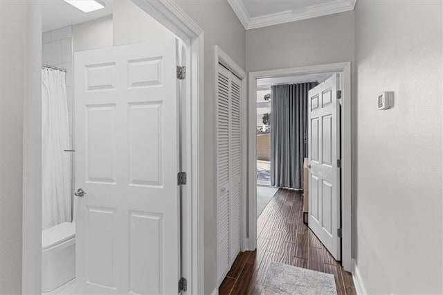 2479 Peachtree Rd NE Unit 105, Atlanta, GA 30305 - corridor featuring crown molding, dark wood-type flooring, and baseboards