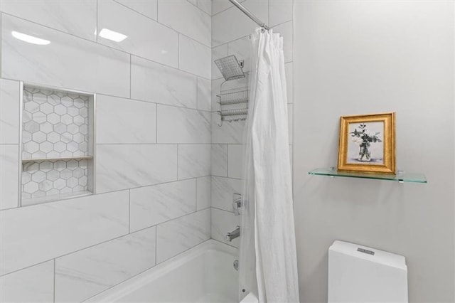 2479 Peachtree Rd NE Unit 105, Atlanta, GA 30305 - bathroom with shower / bathtub combination with curtain and toilet