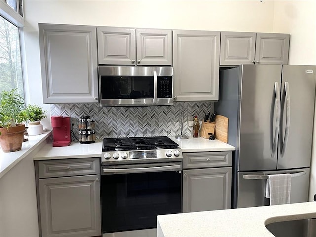 2479 Peachtree Rd NE Unit 105, Atlanta, GA 30305 - kitchen featuring stainless steel appliances, gray cabinetry, and light countertops