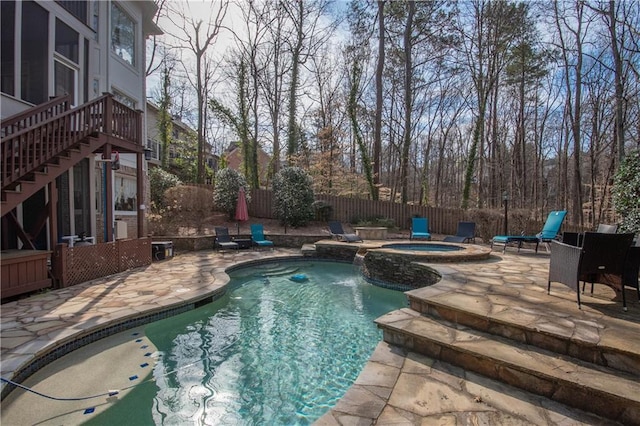 view of swimming pool featuring a patio, stairway, a fenced in pool, an in ground hot tub, and a fenced backyard