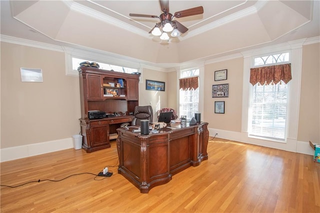 home office featuring plenty of natural light, crown molding, and a tray ceiling