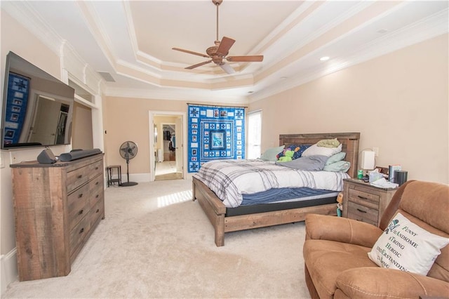 bedroom with crown molding, ceiling fan, baseboards, light carpet, and a raised ceiling