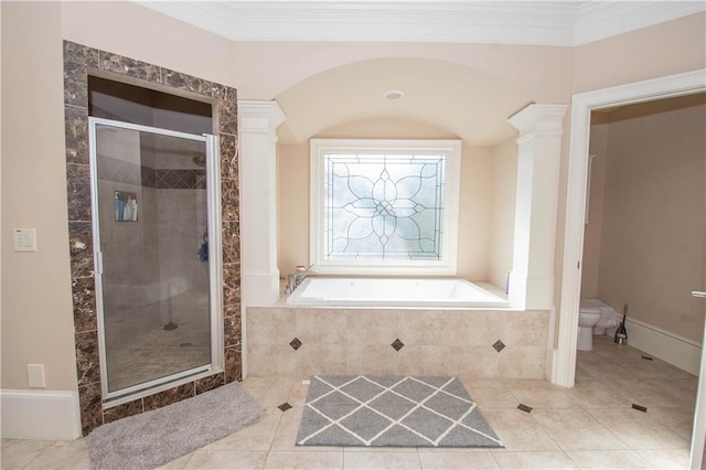 full bath with toilet, decorative columns, a stall shower, and ornamental molding