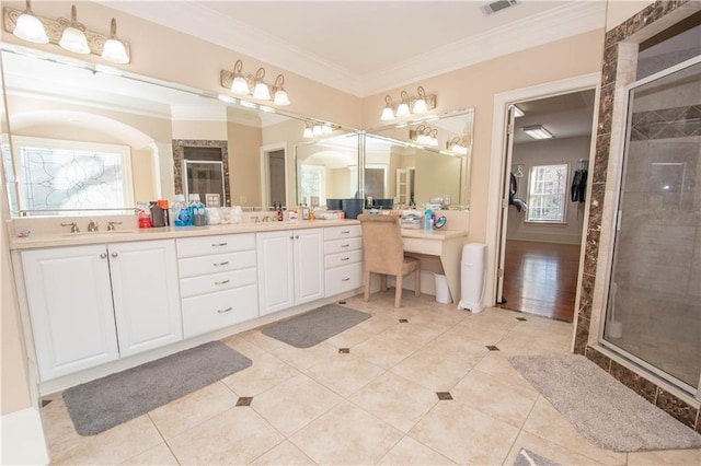 full bathroom featuring a stall shower, ornamental molding, a sink, tile patterned flooring, and double vanity