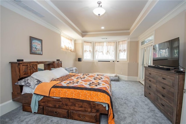 carpeted bedroom featuring crown molding, a raised ceiling, and baseboards