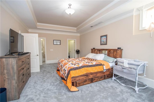 bedroom with a tray ceiling, carpet flooring, crown molding, and baseboards