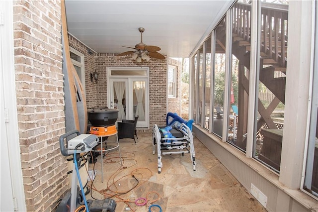 sunroom / solarium with ceiling fan