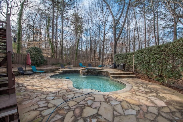 view of swimming pool featuring a fenced in pool, a patio, an in ground hot tub, and a fenced backyard