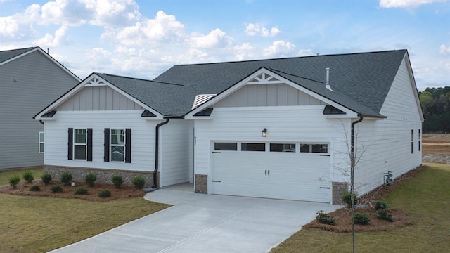 view of front facade with roof with shingles, board and batten siding, a front yard, a garage, and driveway