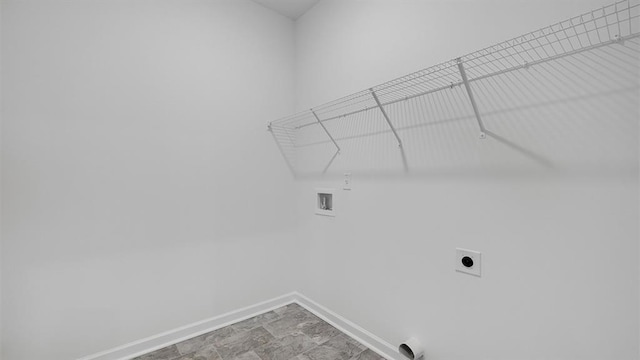 clothes washing area featuring washer hookup, laundry area, electric dryer hookup, and baseboards