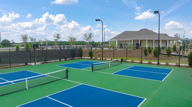 view of sport court featuring community basketball court and fence