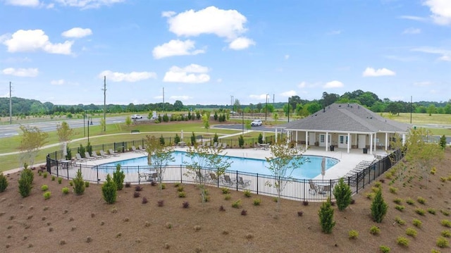 pool featuring a patio and fence