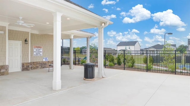 view of patio / terrace featuring a ceiling fan and fence