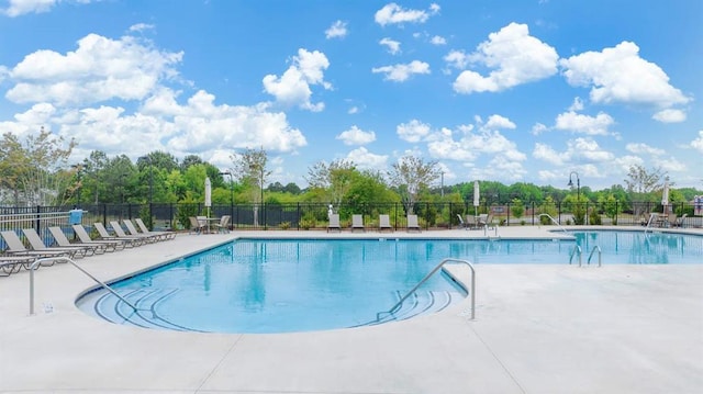 pool featuring a patio and fence