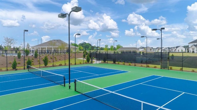 view of sport court featuring community basketball court and fence