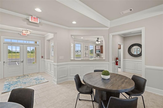 dining room featuring french doors, a wealth of natural light, light tile patterned flooring, and visible vents