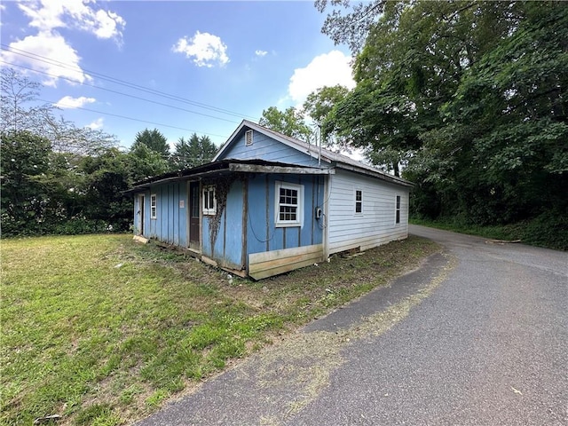 22 Honeysuckle Ln, Dahlonega, GA 30533 - view of home's exterior with a lawn